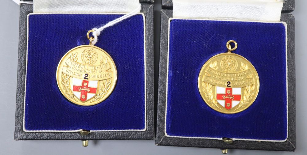 Two modern 9ct. gold and enamel football league championship winners medals, 1982/1983, gross weight 36.6 grams, 31mm.